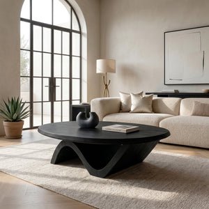 Sculptural Round Coffee Table With Curved Base For Home Decor