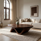 Sculptural Round Coffee Table With Curved Base For Home Decor